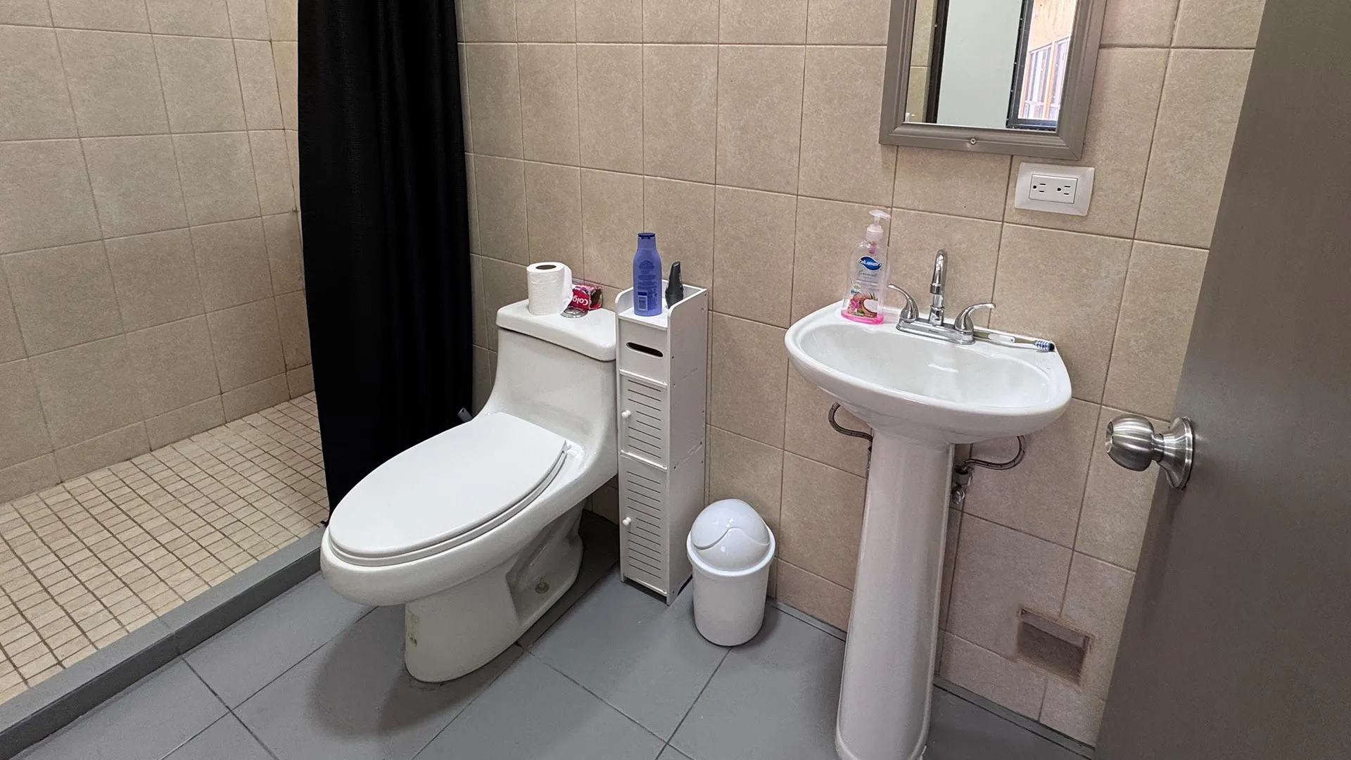 Bathroom with a sink and shower